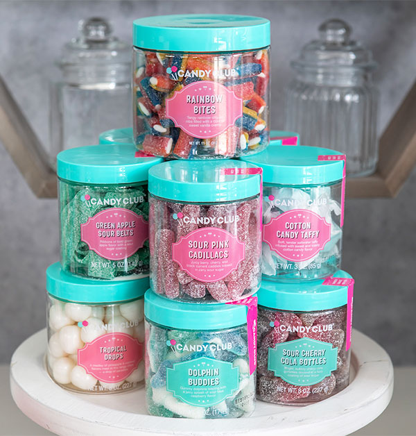 Individual premium candy cups by Candy Club staked in a 3-row pyramid.