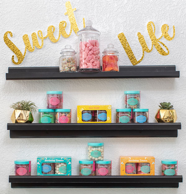 A Candy Club retail partner's 3-row shelf displaying both sour and sweet premium candy
