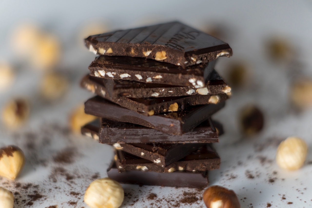 Sliced chocolate bars with nuts stacked